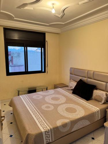 En eller flere senge i et værelse på Petit Apparemment pas chère à 3km du grand stade de rabat