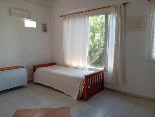 En eller flere senge i et værelse på Casa Boreal dptos estilo casa