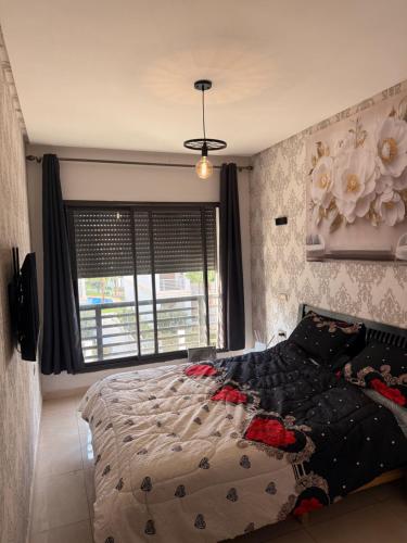 En eller flere senge i et værelse på Cosy appart hotel Bouznika