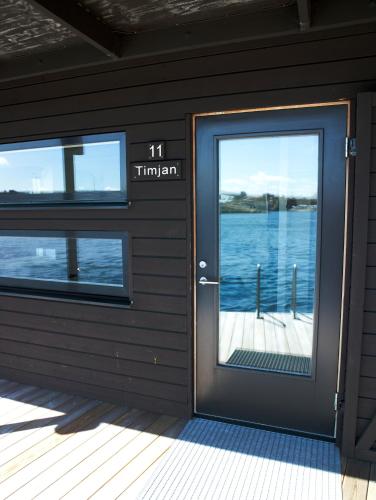 a door on a boat with a view of the water at Salt & Sill in Klädesholmen