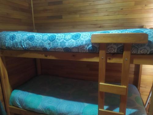 En eller flere køjesenge i et værelse på El ranchito