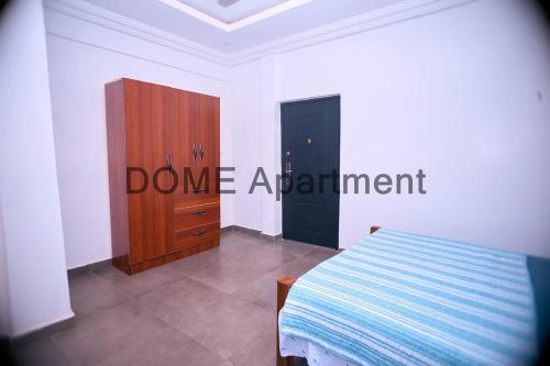 En eller flere senge i et værelse på The Dome Apartment