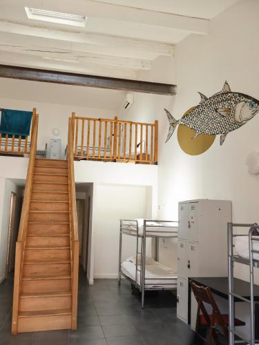 Una cama o camas en una habitación de Vertigo Hostel
