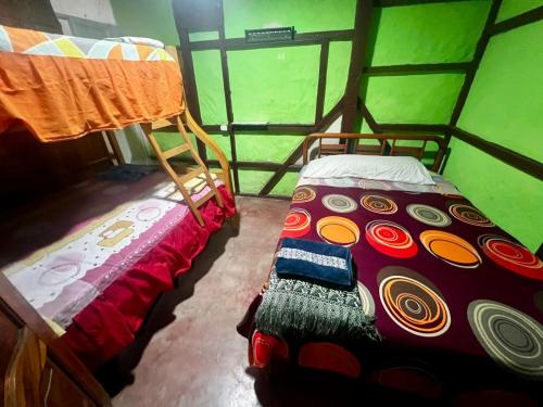 En eller flere senge i et værelse på CasaYaja