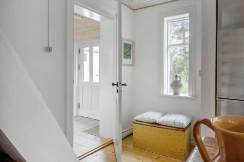 a white hallway with a door and a window at 872-Bedsted-Thy-Lyngbyvej-25 in Bedsted Thy