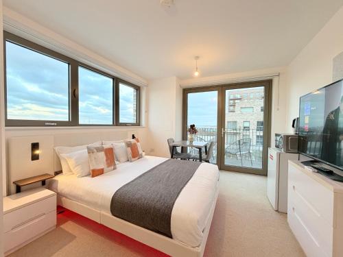 Et tv og/eller underholdning på Riverside Rooms and Apartments