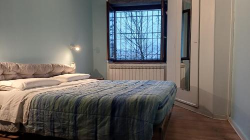 Giường trong phòng chung tại La Tavernetta