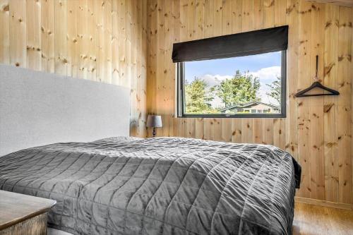 a bedroom with a bed and a window at 157-Thisted-Isfuglevej-17 in Thisted