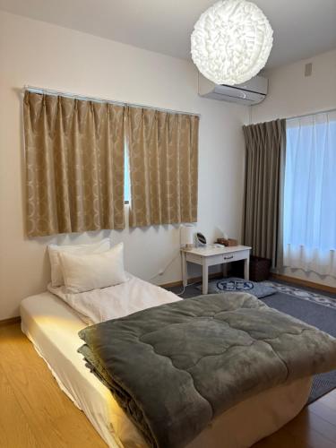 En eller flere senge i et værelse på 青梅森の宿