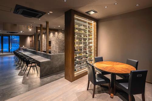 a wine tasting room with a table and chairs at KOS Restaurant & Hotel in Fujikawaguchiko
