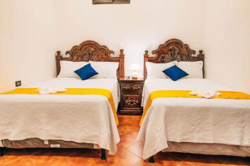 Postel nebo postele na pokoji v ubytování Hotel Villa Luna