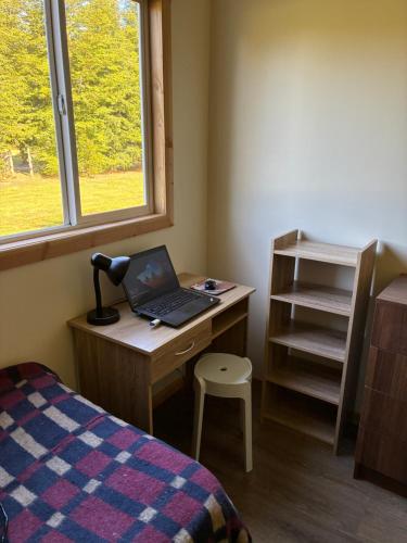 En eller flere senge i et værelse på Cabañas Cuatro Estaciones Frutillar Bajo