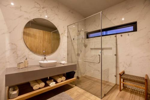 a bathroom with a sink and a mirror at CASA 1111 SMALL in Mazatlán
