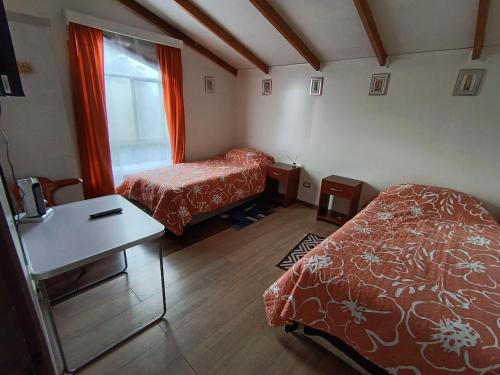 En eller flere senge i et værelse på Kramm House Aldea 47