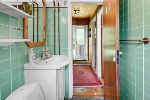 a bathroom with a sink and a toilet at 5011-Askeby-Faergensvaenge-17 in Askeby