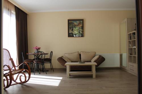 a living room with a couch and a table at House 41 in Tbilisi City