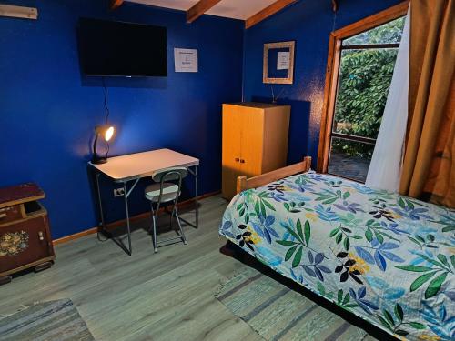 En eller flere senge i et værelse på Kramm House Aldea 47