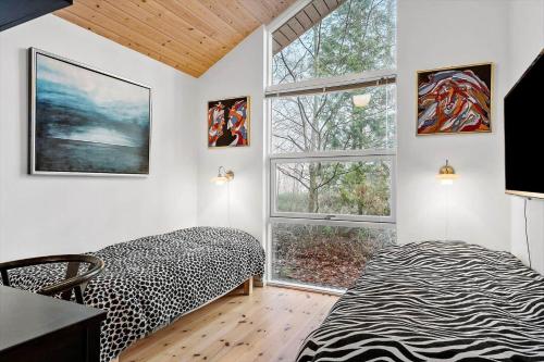 Postel nebo postele na pokoji v ubytování 2305-Stege-Thujavej-2