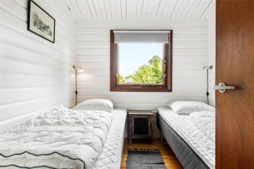 En eller flere senge i et værelse på FA043-Faxe-Ladeplads-Svend-Gongesvej-4