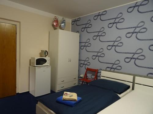 Ένα ή περισσότερα κρεβάτια σε δωμάτιο στο Penzion Eden Turnov