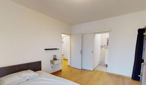 Postel nebo postele na pokoji v ubytování Appartement Moderne et Lumineux