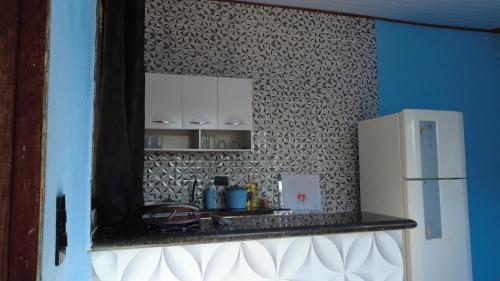 Kuchyň nebo kuchyňský kout v ubytování Chalé toque toque pequeno