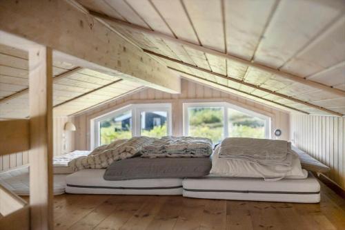 a bedroom with two beds in a tiny house at OH449-Hadsund-Haslevgarde-Eng-49 in Hadsund