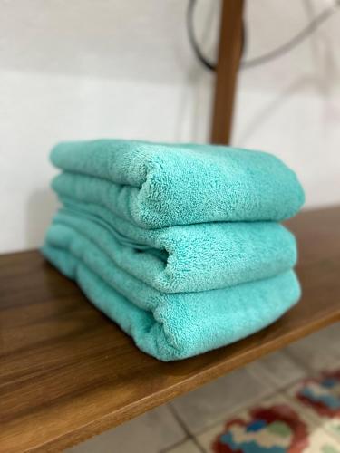 a stack of blue towels sitting on a table at Casa Playa Blanca in Progreso