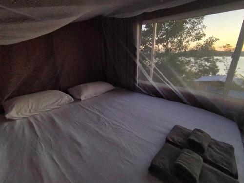 Postel nebo postele na pokoji v ubytování Totò Pizza Bungalows and Sea View Restaurant