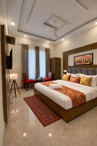 En eller flere senge i et værelse på Hotel Wood Lark by Sidham Group # Budget Friendly