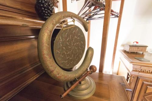 a large round mirror on a stand on a table at B&B Luxury in Lecce