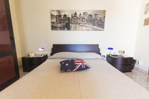 a bedroom with a bed with a british flag pillow on it at B&B Luxury in Lecce