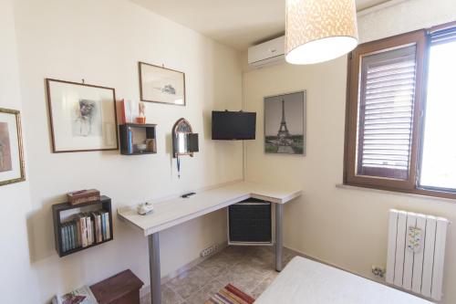 a home office with a desk and a window at B&B Luxury in Lecce