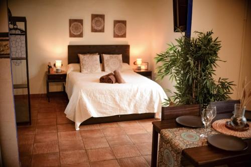 En eller flere senge i et værelse på Rincón ÁRABE junto al TEMPLO ROMANO y AYUNTAMIENTO