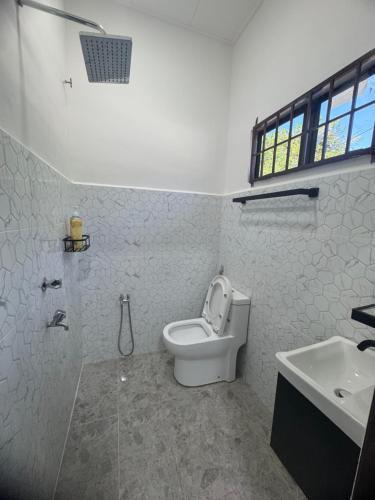 Koupelna v ubytování Nawra Iman Bayu Homestay