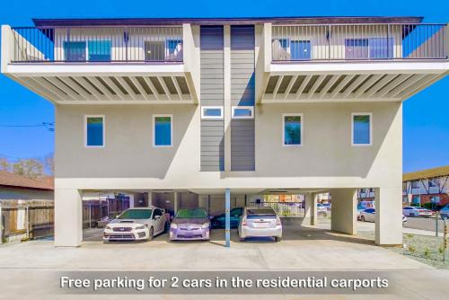a building with two cars parked in the parking lot at Entire Private Home with 3 Bedrooms 3 Bathrooms, Near San Diego Downtown & Beach, Available Now in National City