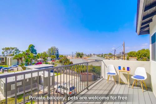 a balcony with two chairs and a table at Entire Private Home with 3 Bedrooms 3 Bathrooms, Near San Diego Downtown & Beach, Available Now in National City