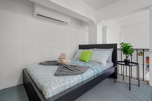 a bedroom with a bed with a teddy bear on it at Old San Juan - Loft Balcony in San Juan