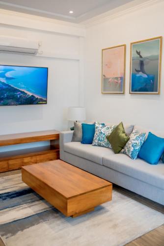 a living room with a couch and a coffee table at Alankara Retreats Colombo 07 in Colombo