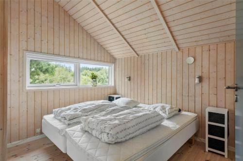 a bedroom with a large bed in a room with a window at LF21631-Spottrup-Vibevej-3 in Spottrup