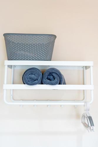 a white shelf with two towels on it at Peridot Pool Beach in Chaweng Noi Beach
