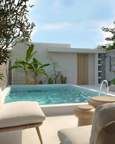 a swimming pool in the backyard of a house at Casa Euphoria in Elounda
