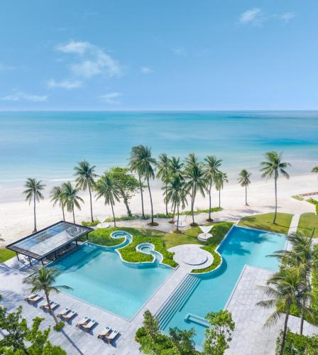 an aerial view of a resort with a swimming pool and the beach at Centara Reserve Samui in Chaweng