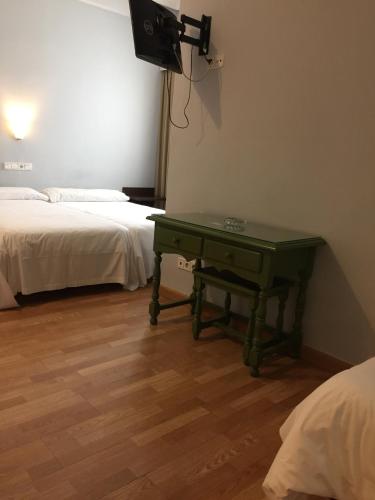 Ένα ή περισσότερα κρεβάτια σε δωμάτιο στο Hotel Madrid Río