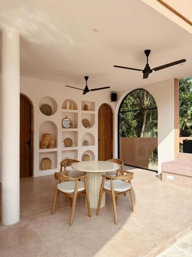 a dining room with a table and chairs at Together Boutique Villa in Ahangama