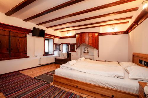 En eller flere senge i et værelse på Къща за гости Родопчани