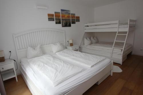 En eller flere senge i et værelse på Rosies Family Apartment Bad Kleinkirchheim