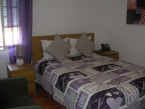Katil atau katil-katil dalam bilik di Reguengos Hotel