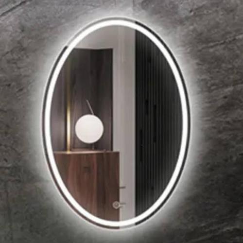 een ronde spiegel aan een muur met een lamp bij Citi in Guadalajara