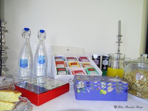 a table with bottles and other items on it at Agulhas Ocean House in Agulhas